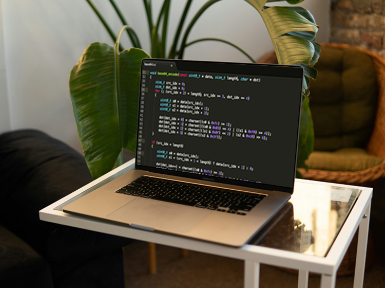 free macbook pro on small table mockup